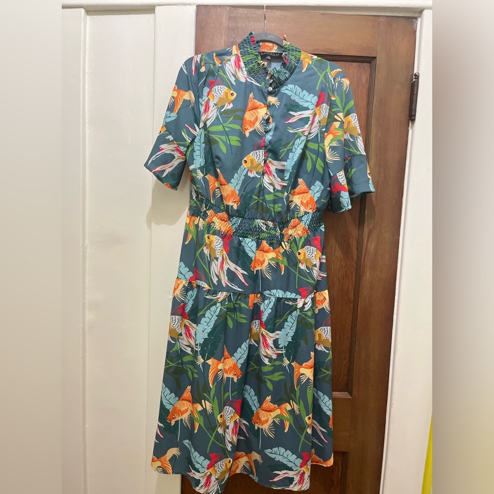 Unique, short-sleeve dress. Perfect for summer outings.